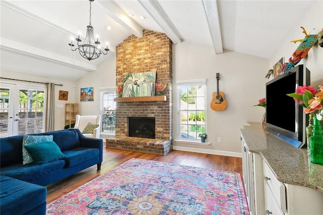 47 Yellowstone Dr, New Orleans, LA 70131 - living area featuring a chandelier, a brick fireplace, wood finished floors, french doors, and baseboards