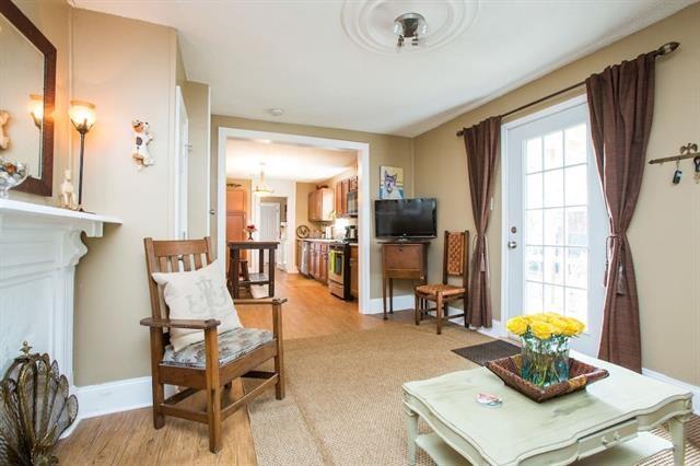living area with baseboards and light wood-style floors