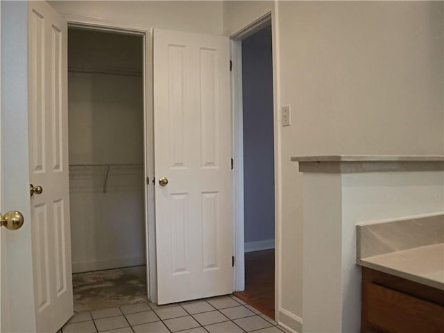 20102 Garland St, Covington, LA 70435 - bathroom with vanity, tile patterned floors, and baseboards