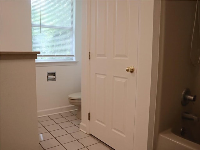 20102 Garland St, Covington, LA 70435 - full bathroom with tile patterned flooring, toilet, bathing tub / shower combination, and baseboards
