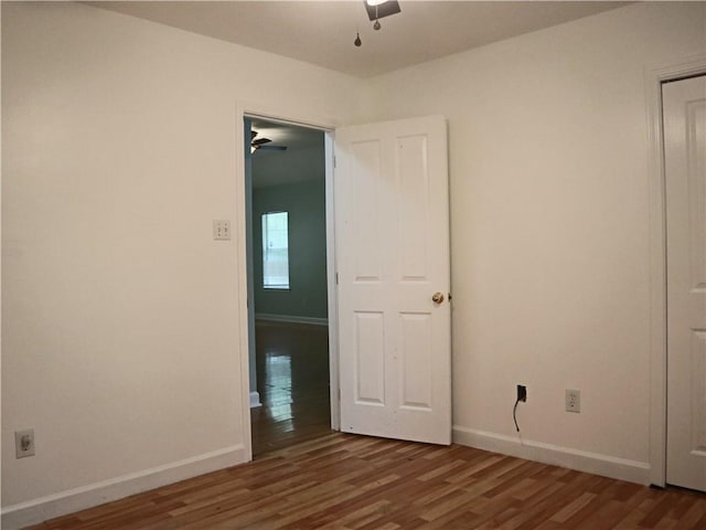 20102 Garland St, Covington, LA 70435 - unfurnished bedroom with wood finished floors, baseboards, and ceiling fan