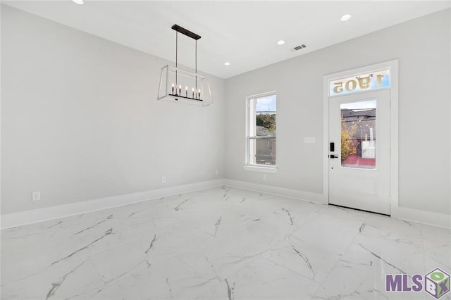 unfurnished dining area featuring baseboards, marble finish floor, visible vents, and recessed lighting