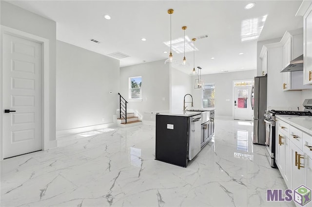 kitchen featuring an island with sink, visible vents, exhaust hood, appliances with stainless steel finishes, and recessed lighting