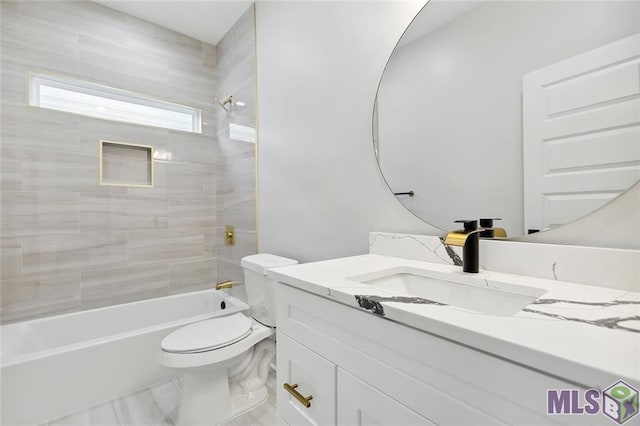 full bathroom featuring toilet, marble finish floor, vanity, and shower / bathtub combination