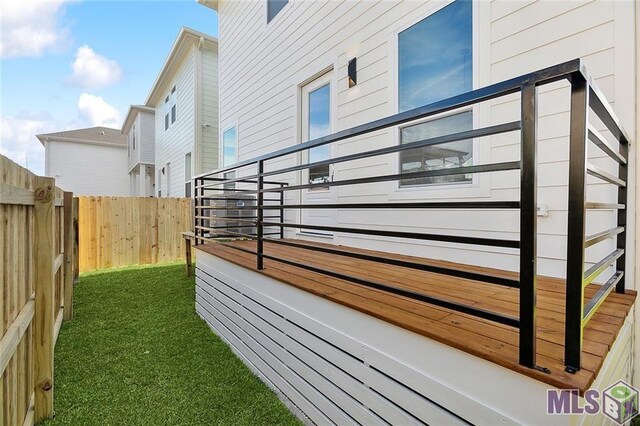 view of home's exterior featuring fence