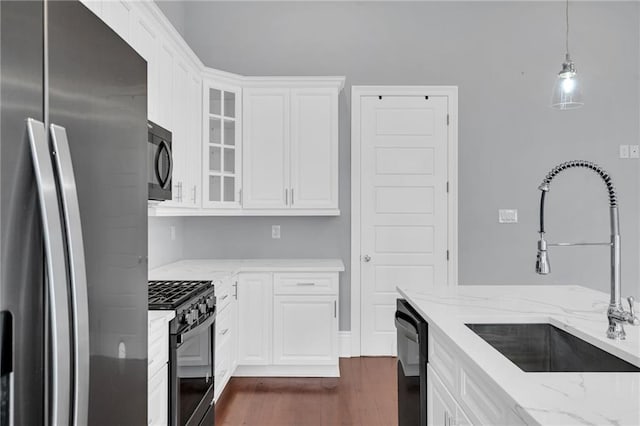 2540 Saint Ann St, New Orleans, LA 70119 - kitchen with black appliances, a sink, dark wood-style flooring, glass insert cabinets, and white cabinets