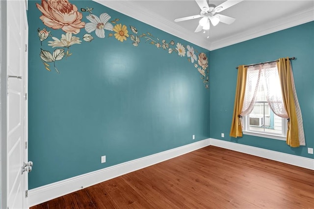 2540 Saint Ann St, New Orleans, LA 70119 - spare room featuring baseboards, wood finished floors, ornamental molding, and a ceiling fan