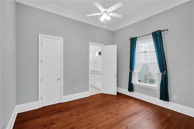 2540 Saint Ann St, New Orleans, LA 70119 - unfurnished bedroom featuring ornamental molding, wood finished floors, baseboards, ensuite bathroom, and ceiling fan