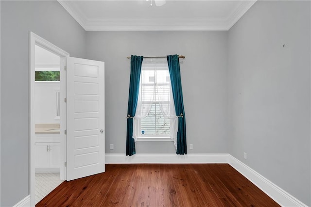 2540 Saint Ann St, New Orleans, LA 70119 - empty room with dark wood-type flooring, crown molding, and baseboards