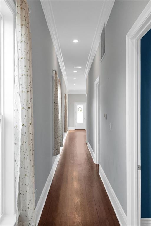 2540 Saint Ann St, New Orleans, LA 70119 - hallway with dark wood finished floors, ornamental molding, baseboards, and recessed lighting