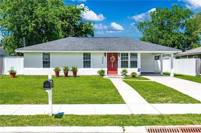ranch-style house with concrete driveway, a shingled roof, and an attached carport