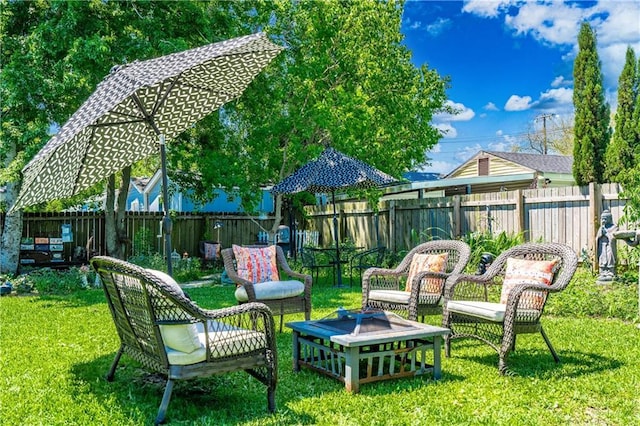 view of yard featuring an outdoor fire pit