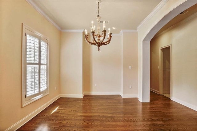 717 Tunica Bnd, Covington, LA 70433 - empty room with arched walkways, a chandelier, dark wood-type flooring, crown molding, and baseboards