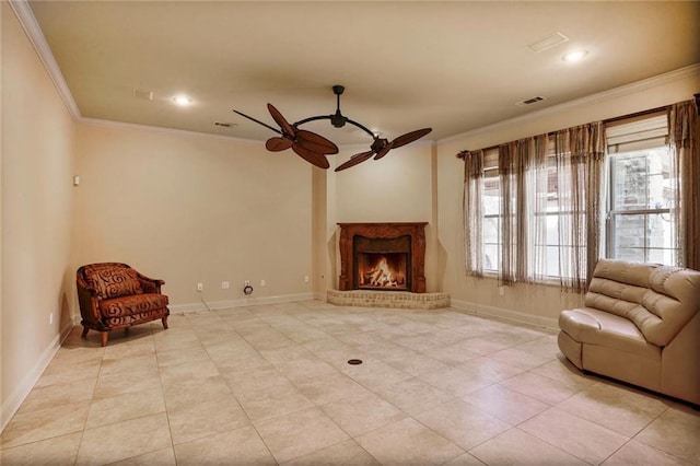 living area with ceiling fan, crown molding, light tile patterned floors, baseboards, and recessed lighting