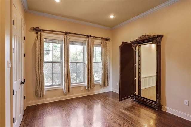 717 Tunica Bnd, Covington, LA 70433 - unfurnished room featuring dark wood finished floors, baseboards, healthy amount of natural light, crown molding, and recessed lighting