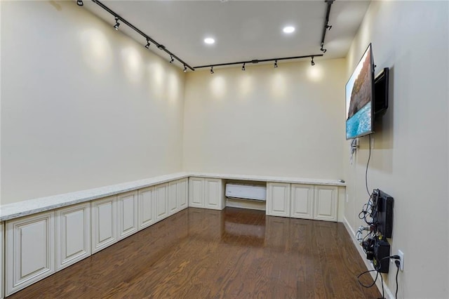 717 Tunica Bnd, Covington, LA 70433 - spare room with track lighting and dark wood-type flooring