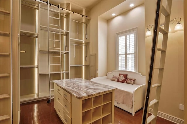 717 Tunica Bnd, Covington, LA 70433 - spacious closet featuring dark wood-style flooring