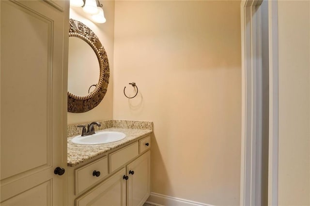 717 Tunica Bnd, Covington, LA 70433 - bathroom with vanity and baseboards