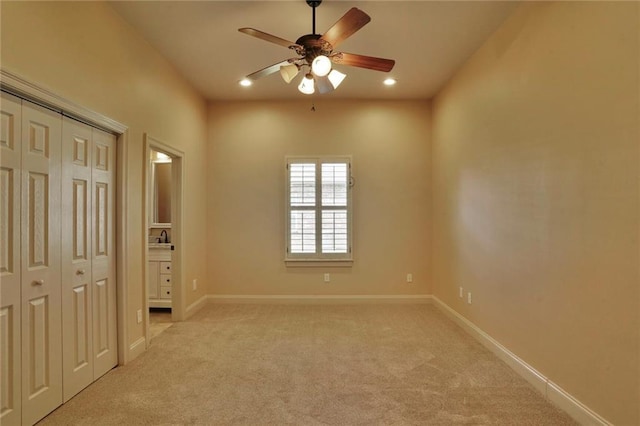 717 Tunica Bnd, Covington, LA 70433 - unfurnished bedroom with light colored carpet, baseboards, a closet, recessed lighting, and a ceiling fan