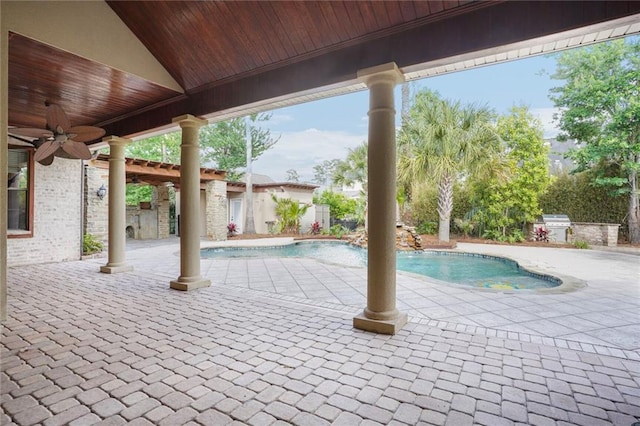 717 Tunica Bnd, Covington, LA 70433 - view of swimming pool featuring ceiling fan, a patio, and an outdoor kitchen