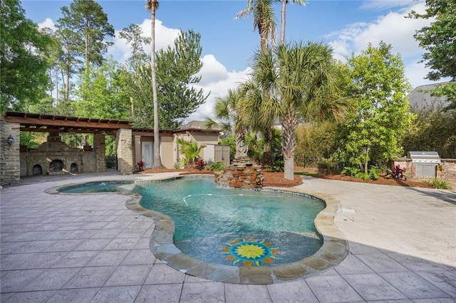 717 Tunica Bnd, Covington, LA 70433 - outdoor pool with a patio area, an outdoor stone fireplace, and area for grilling