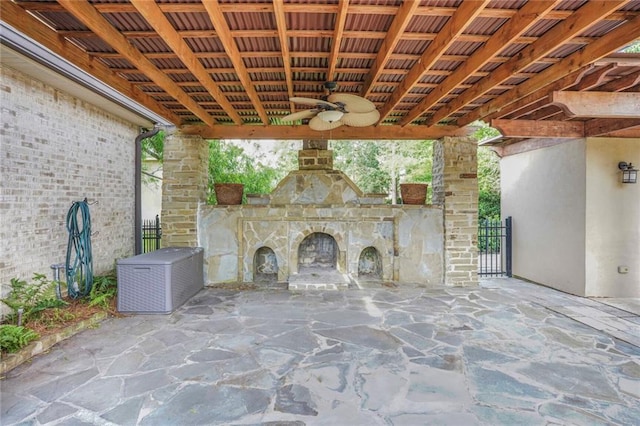 717 Tunica Bnd, Covington, LA 70433 - view of patio / terrace featuring an outdoor stone fireplace, ceiling fan, and fence