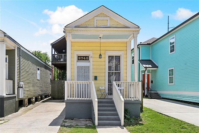 2748 Bienville St, New Orleans, LA 70119 - shotgun-style home with a porch