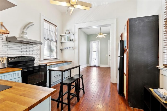 2748 Bienville St, New Orleans, LA 70119 - kitchen featuring wooden counters, black appliances, a ceiling fan, and healthy amount of natural light