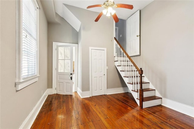2748 Bienville St, New Orleans, LA 70119 - foyer featuring hardwood / wood-style floors, a ceiling fan, baseboards, and stairway