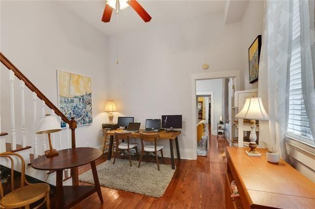 2748 Bienville St, New Orleans, LA 70119 - home office featuring a high ceiling, a ceiling fan, and wood finished floors