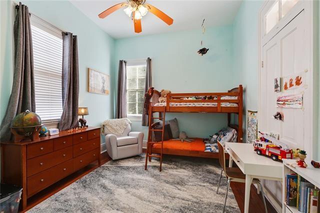 2748 Bienville St, New Orleans, LA 70119 - bedroom with wood finished floors and a ceiling fan