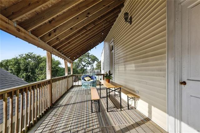 2748 Bienville St, New Orleans, LA 70119 - wooden deck featuring outdoor dining area
