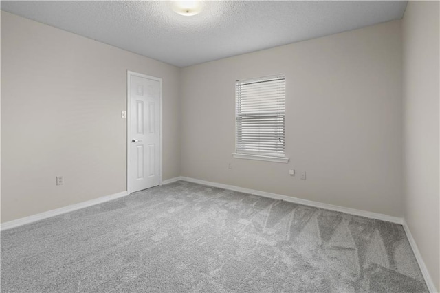 6705 Alisa Dr, Slidell, LA 70460 - spare room with carpet flooring, a textured ceiling, and baseboards