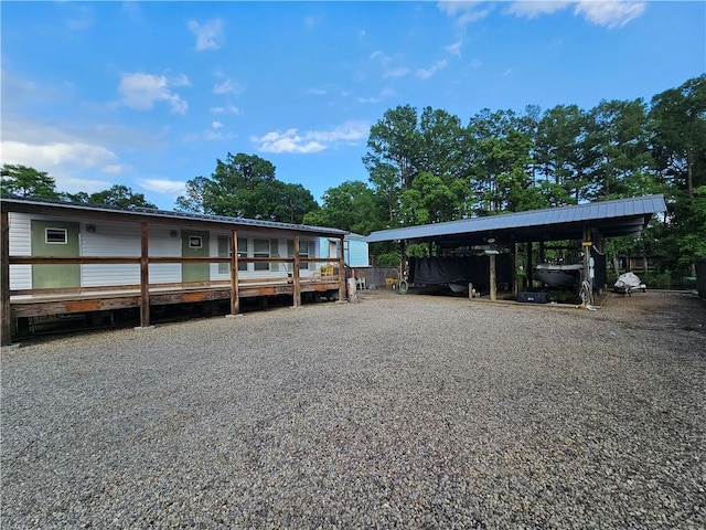 31668 Shelton Dr, Springfield, LA 70462 - view of vehicle parking with a detached carport and driveway