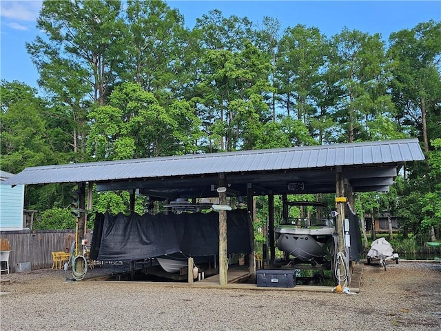 31668 Shelton Dr, Springfield, LA 70462 - view of parking with a carport