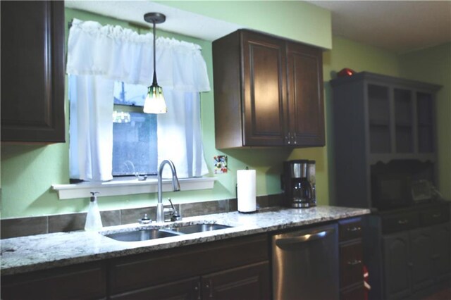 2 Birdie Dr Unit 1D, Slidell, LA 70460 - kitchen with dishwasher, dark brown cabinets, a sink, and light stone counters