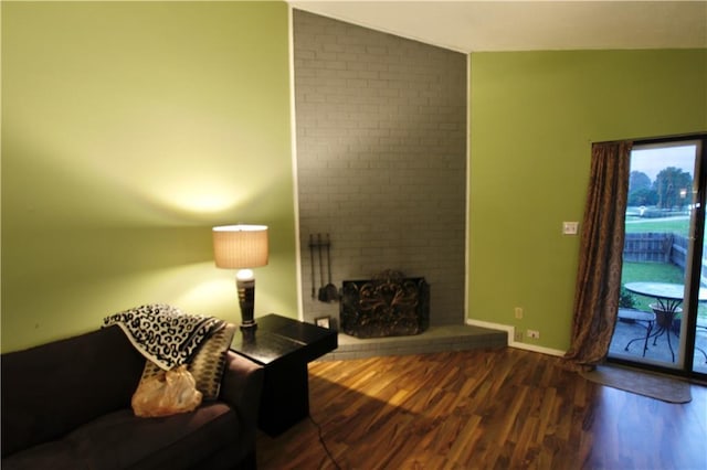 2 Birdie Dr Unit 1D, Slidell, LA 70460 - living area featuring wood finished floors, lofted ceiling, baseboards, and a fireplace