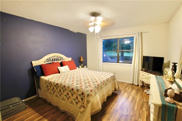 2 Birdie Dr Unit 1D, Slidell, LA 70460 - bedroom with wood finished floors and ceiling fan