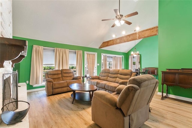 28189 Creole Rd, Lacombe, LA 70445 - living area featuring high vaulted ceiling, wood finished floors, healthy amount of natural light, and ceiling fan