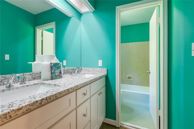 28189 Creole Rd, Lacombe, LA 70445 - bathroom with a bathtub and double vanity