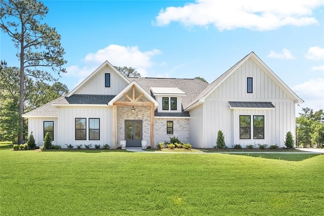 605 Northwoods Dr, Abita Springs, LA 70420 - modern farmhouse style home with french doors, board and batten siding, and a front lawn