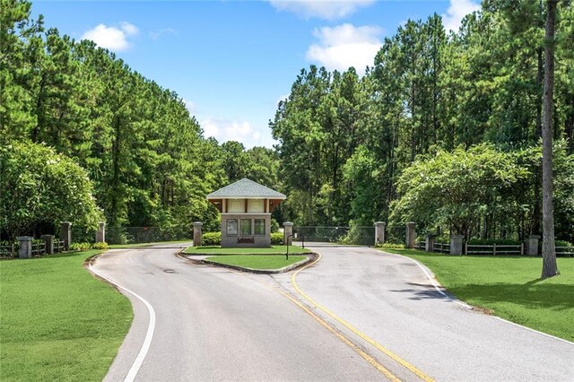 605 Northwoods Dr, Abita Springs, LA 70420 - view of asphalt road featuring view of wooded area