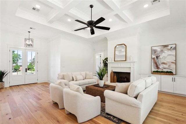 605 Northwoods Dr, Abita Springs, LA 70420 - living room with coffered ceiling, light wood finished floors, a fireplace, beamed ceiling, and a ceiling fan
