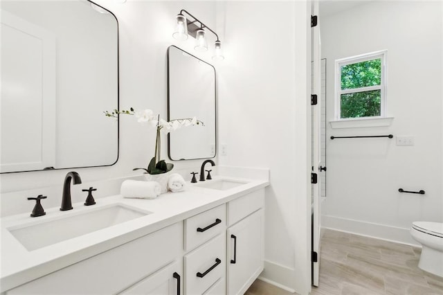 605 Northwoods Dr, Abita Springs, LA 70420 - full bath with baseboards, toilet, and double vanity