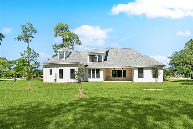 605 Northwoods Dr, Abita Springs, LA 70420 - rear view of house with a yard, a patio area, board and batten siding, a ceiling fan, and roof with shingles