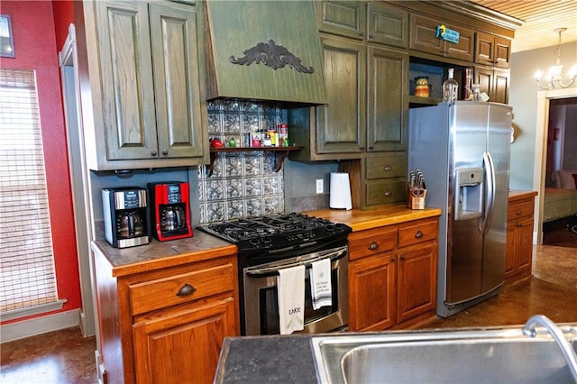 kitchen with stainless steel appliances, tile countertops, backsplash, open shelves, and a chandelier