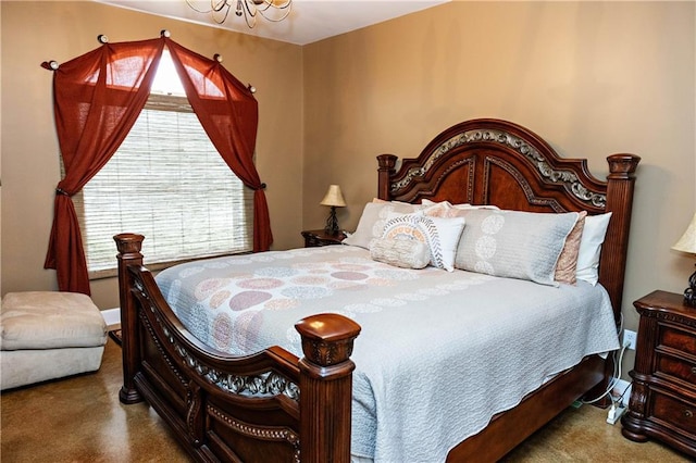 bedroom featuring a chandelier and baseboards