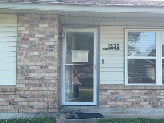 1535 Natchez Ln, La Place, LA 70068 - doorway to property with brick siding