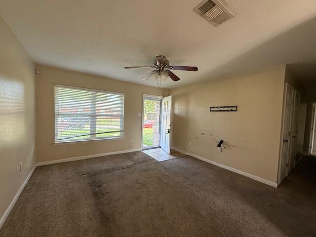 1535 Natchez Ln, La Place, LA 70068 - carpeted spare room with ceiling fan, healthy amount of natural light, and baseboards