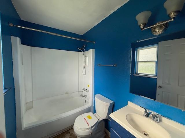 1535 Natchez Ln, La Place, LA 70068 - bathroom with toilet, tub / shower combination, vanity, and tile patterned floors